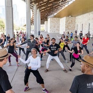  Attendees engaging in wellness activities at a previous SXSW Wellness Expo