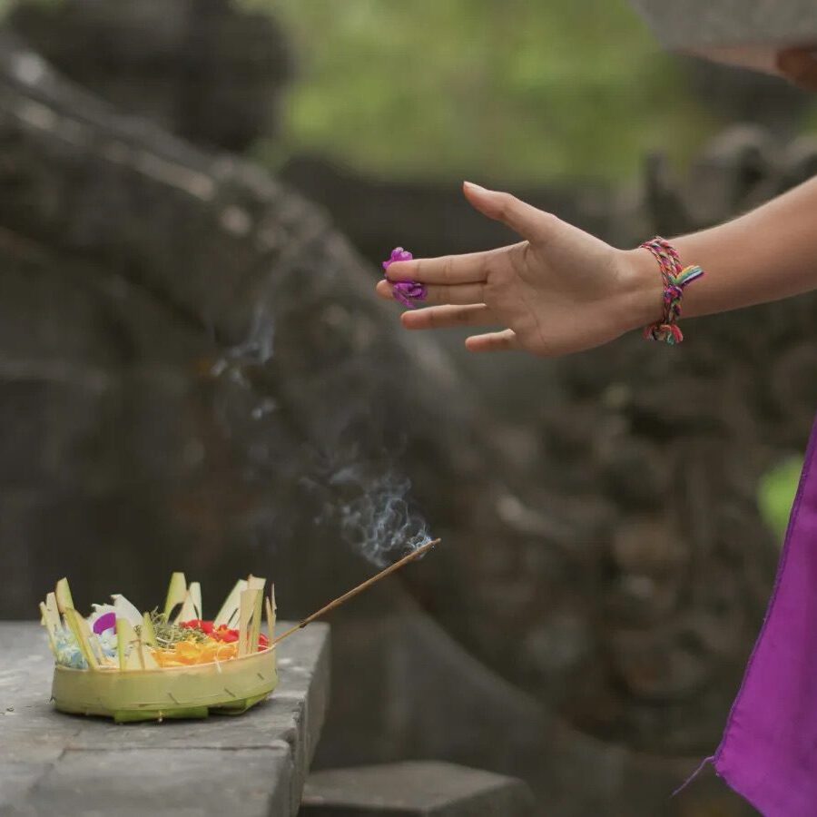 A serene offering made while overlooking the ocean at Alila Villas Uluwatu, Bali.